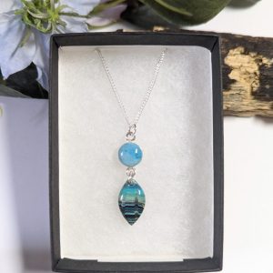 Ocean Waves Necklace - blue, green and black wavy patter leaf shape pendant and tropical ocean blue connector pendant on a sterling silver chain